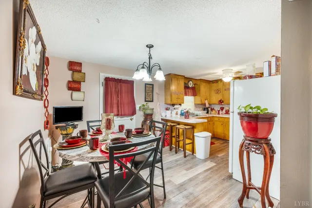 a kitchen with a stove a sink and cabinets