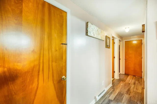 a bathroom with a sink mirror vanity and toilet