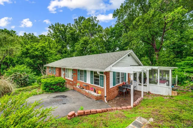 a house with trees in the background