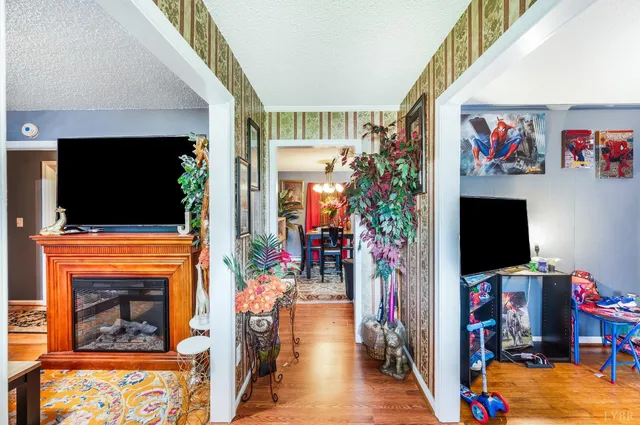 a living room with fireplace furniture and a flat screen tv
