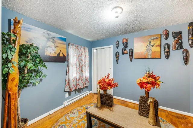 a dining room with furniture and flowers