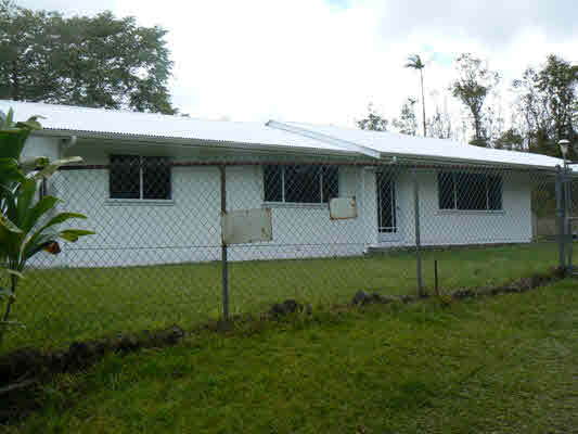 18-8023 North Kulani Road Mountain View, HI 96771 - Photo 2 of 9 a view of a house with a backyard