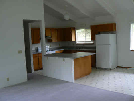 18-8023 North Kulani Road Mountain View, HI 96771 - Photo 4 of 9 a kitchen that has a sink and a stove in it