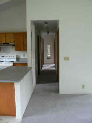 18-8023 North Kulani Road Mountain View, HI 96771 - Photo 6 of 9 a kitchen with a sink and a refrigerator