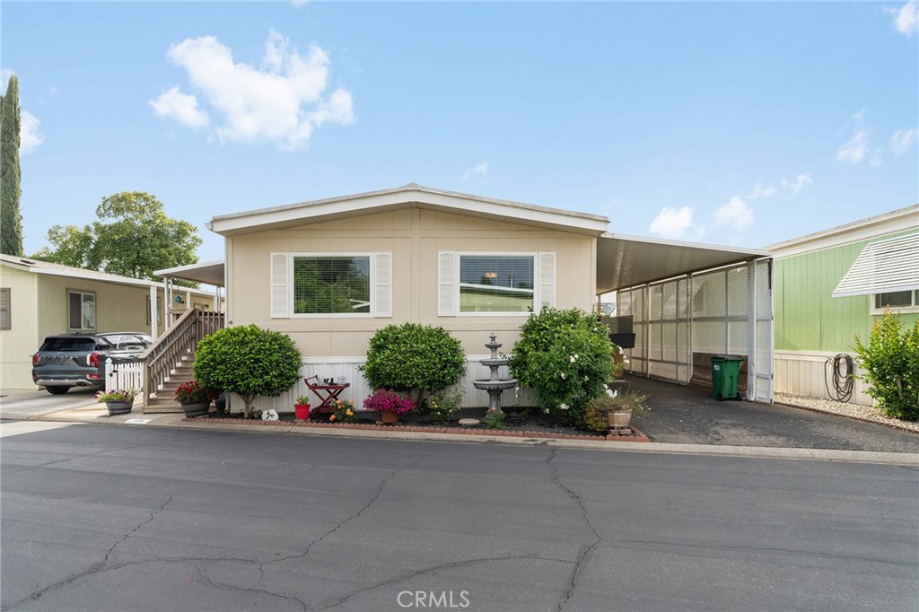 1901 Dayton, Unit 128 Chico, CA 95928 - Photo 1 of 44 a front view of a house with a yard