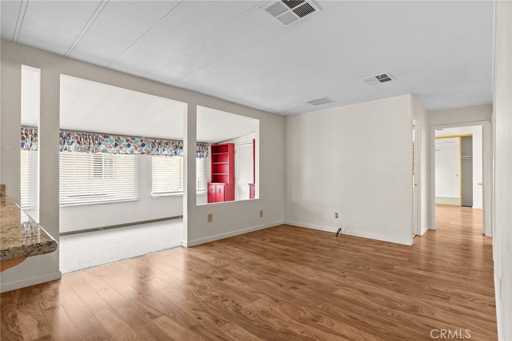 1901 Dayton, Unit 128 Chico, CA 95928 - Photo 12 of 44 an empty room with wooden floor and windows