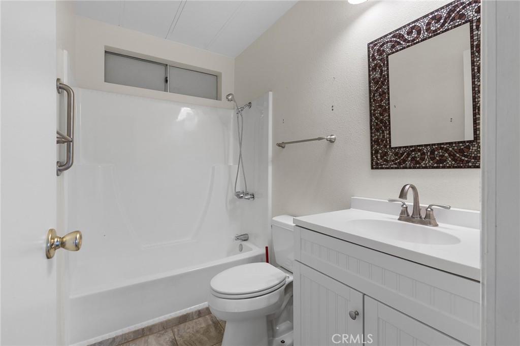 1901 Dayton, Unit 128 Chico, CA 95928 - Photo 17 of 44 a bathroom with a sink a toilet and shower