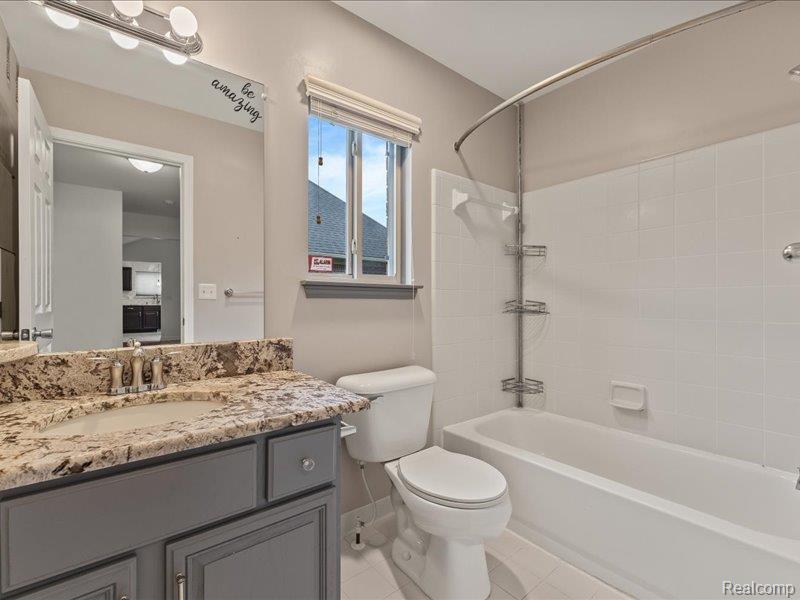 29213 Rachid Lane New Baltimore, MI 48047 - Photo 16 of 26 Full bathroom featuring vanity, shower / bathtub combination, and light tile patterned floors