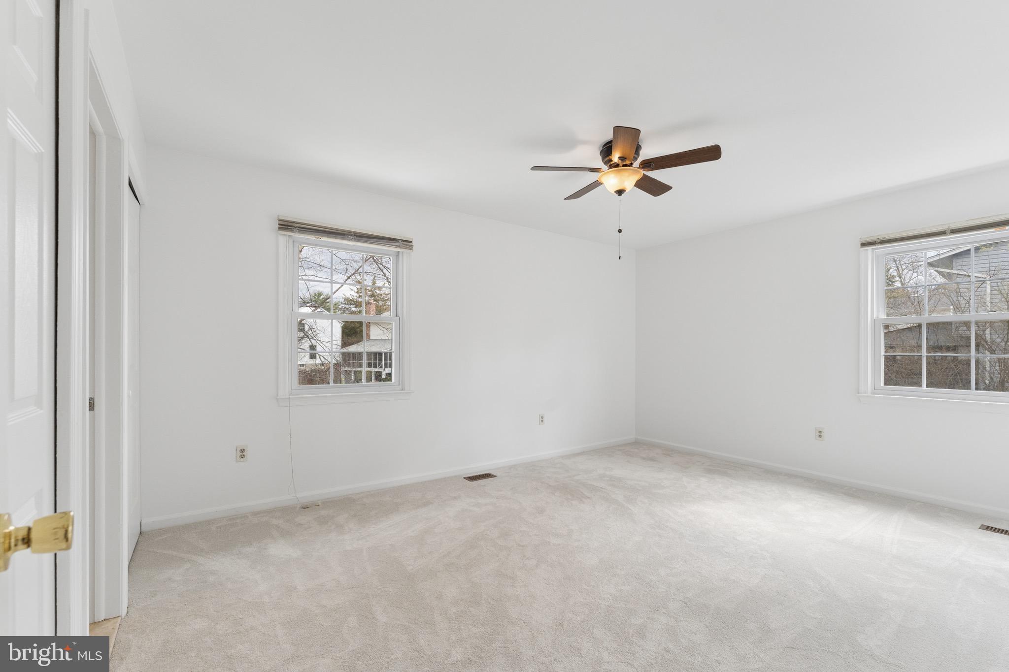 8910 Spur Road Springfield, VA 22153 - Photo 17 of 45 an empty room with windows and fan