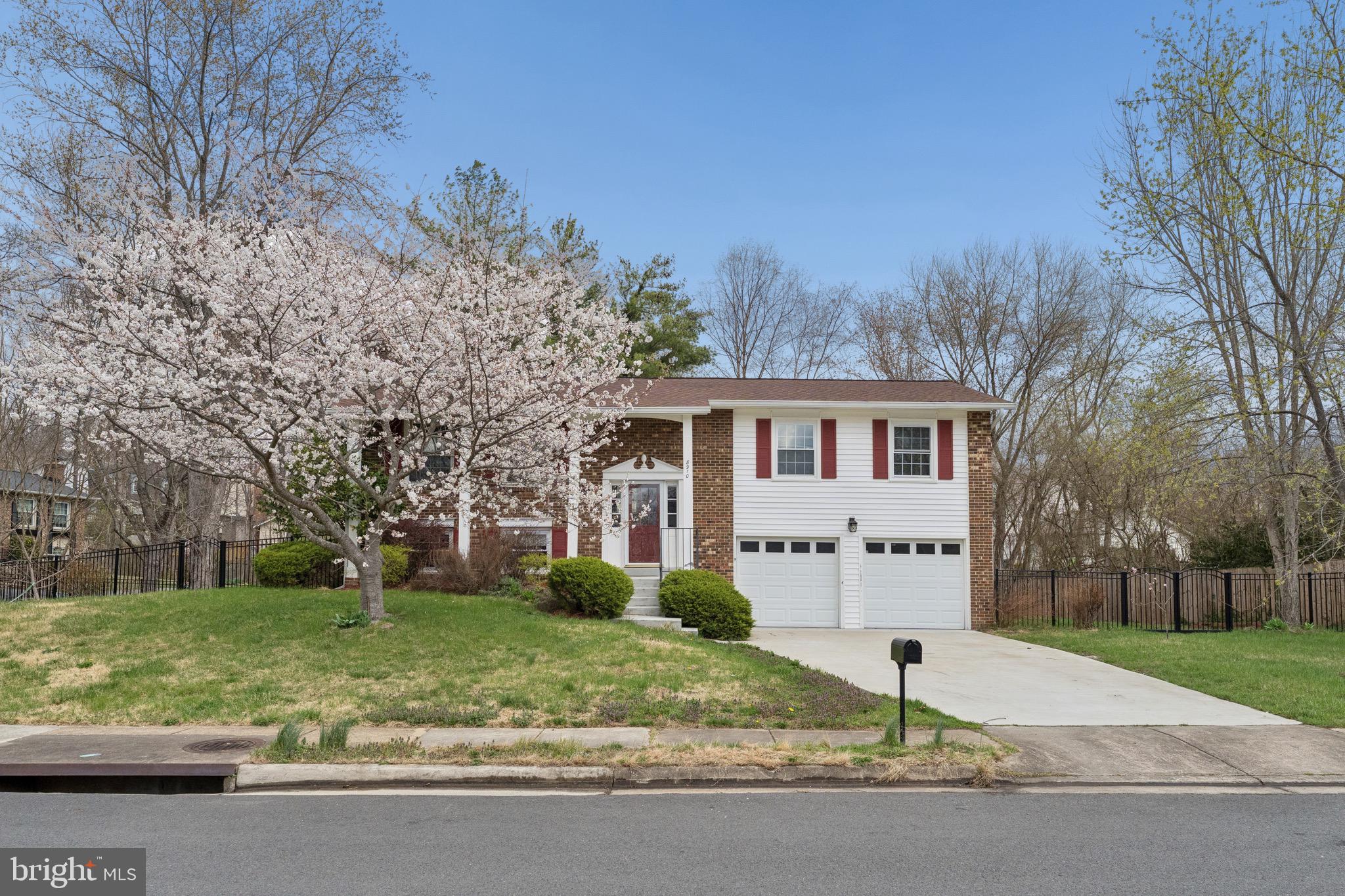 8910 Spur Road Springfield, VA 22153 - Photo 2 of 45 a front view of house with yard and green space