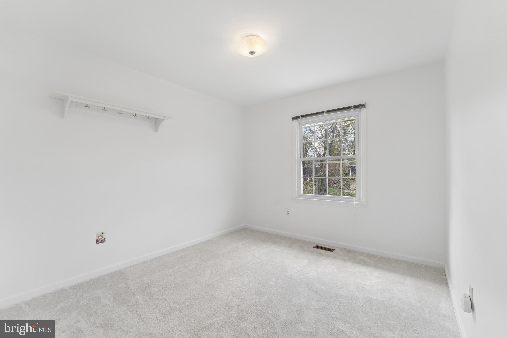 8910 Spur Road Springfield, VA 22153 - Photo 22 of 45 a view of an empty room with a window