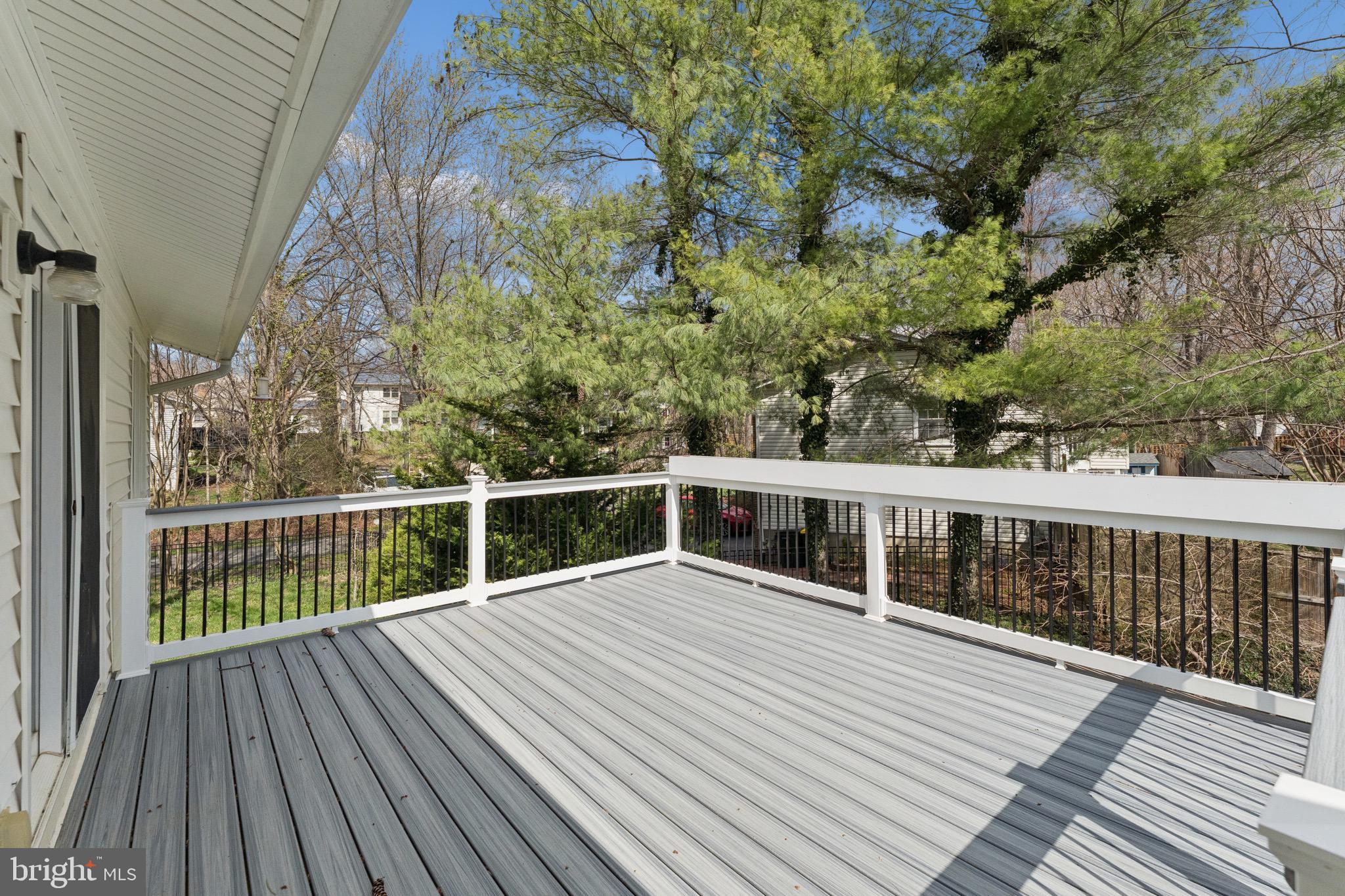 8910 Spur Road Springfield, VA 22153 - Photo 26 of 45 a view of balcony with wooden floor and fence