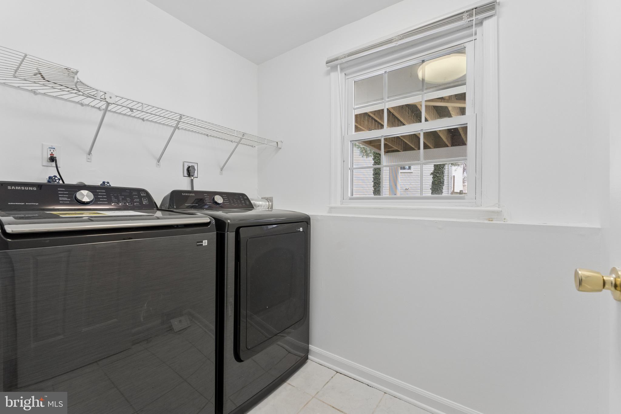 8910 Spur Road Springfield, VA 22153 - Photo 34 of 45 a utility room with dryer and washer