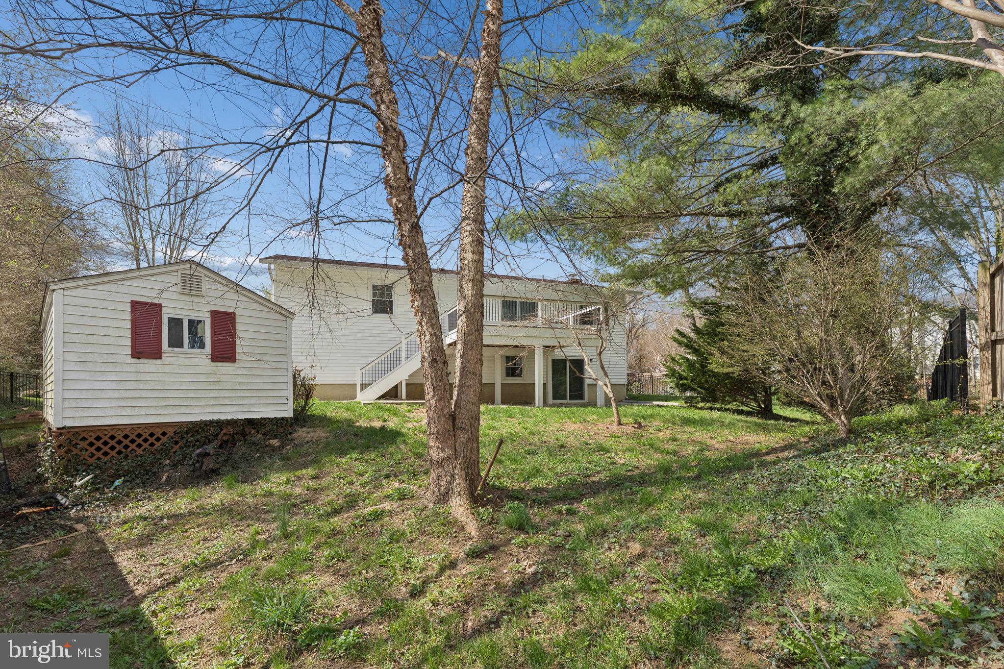 8910 Spur Road Springfield, VA 22153 - Photo 38 of 45 a view of a house with a yard