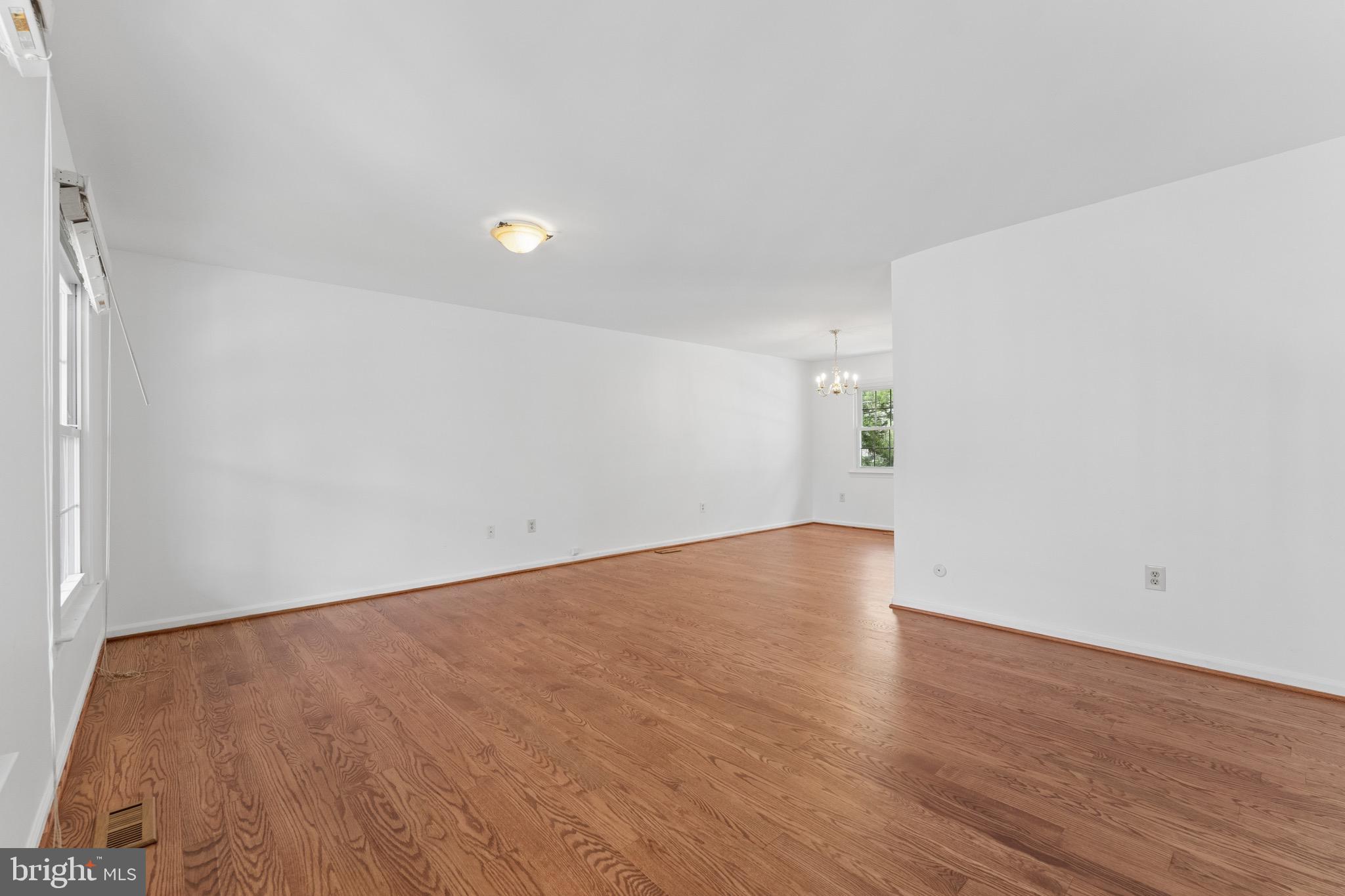 8910 Spur Road Springfield, VA 22153 - Photo 5 of 45 a view of an empty room with wooden floor