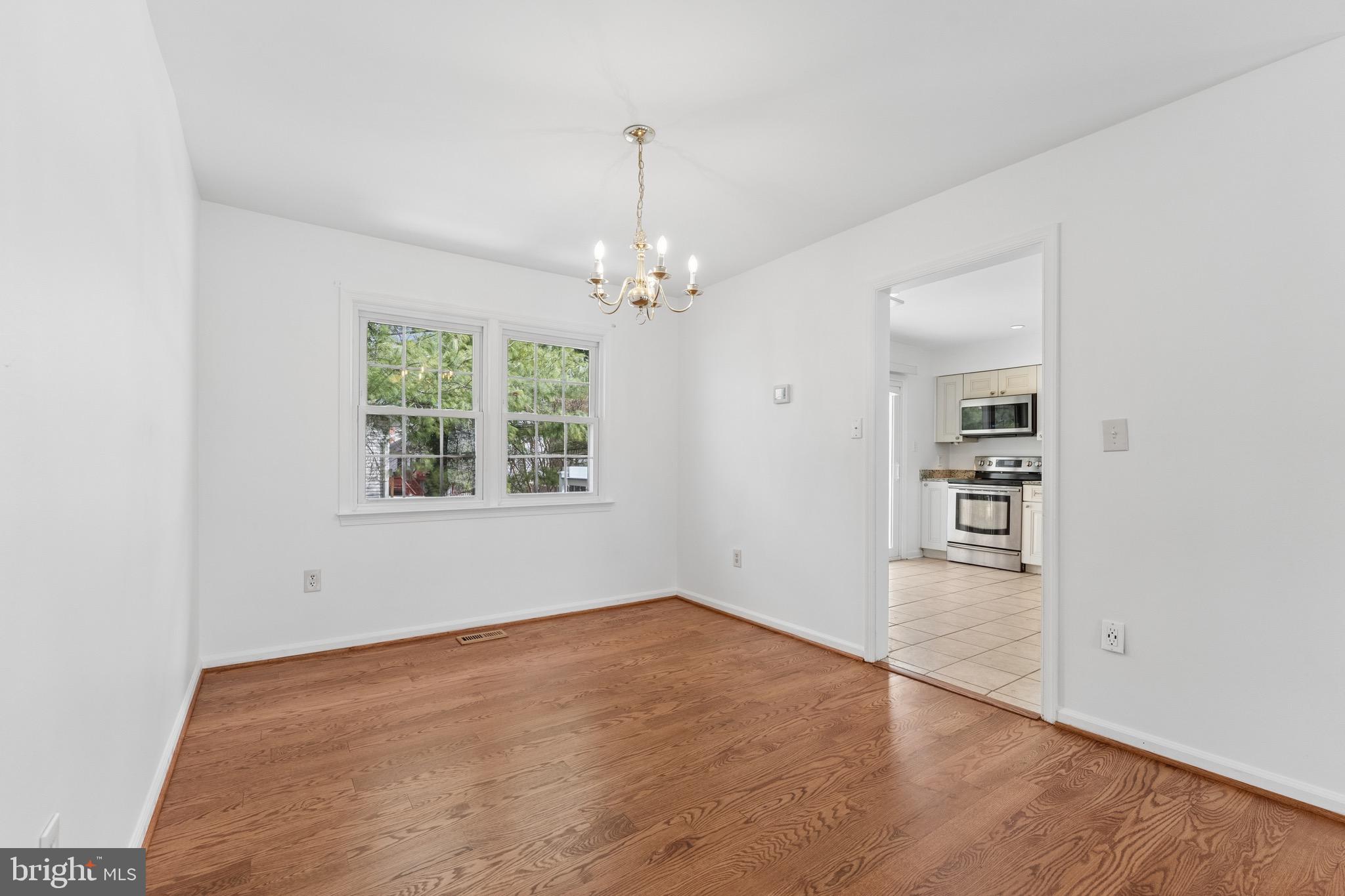 8910 Spur Road Springfield, VA 22153 - Photo 9 of 45 an empty room with windows and entrance