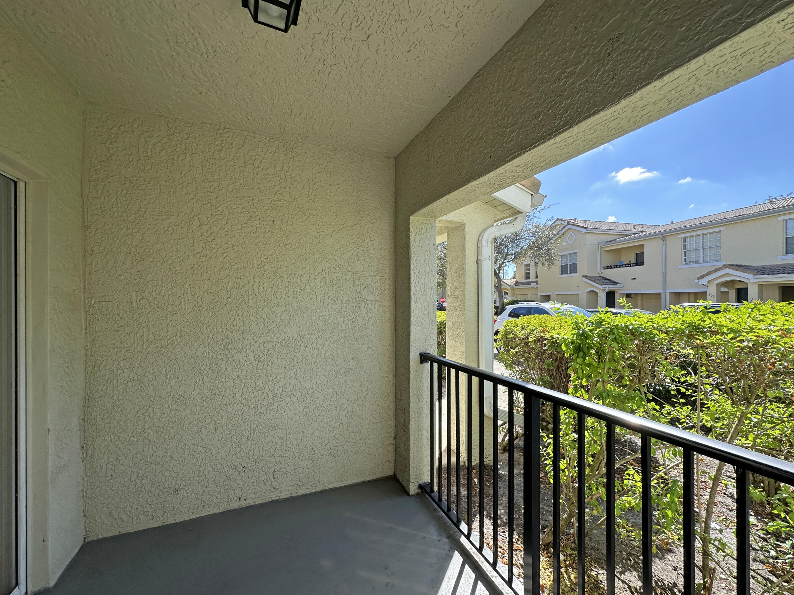 166 Southwest Peacock Boulevard, Unit 104 Port St. Lucie, FL 34986 - Photo 24 of 45 a view of a balcony