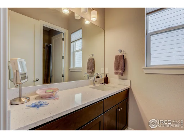 a kitchen with stainless steel appliances granite countertop a refrigerator stove and sink