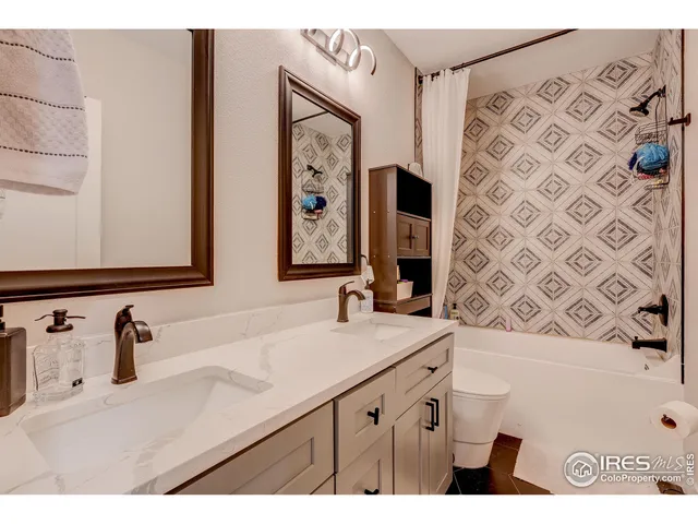 a dining room with furniture and a kitchen view