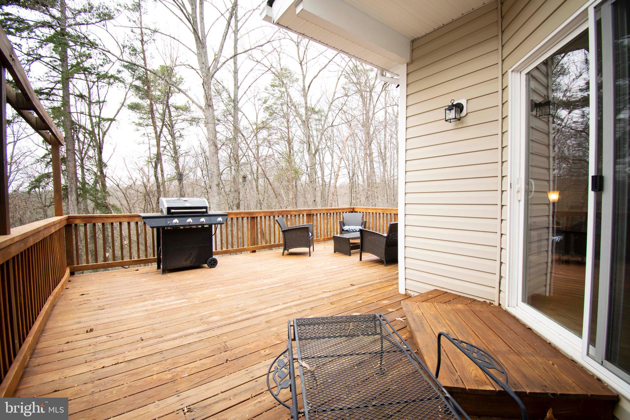 2556 Running Wolf Trail Odenton, MD 21113 - Photo 20 of 36 Deck full width of home overlooks Nature Preserve