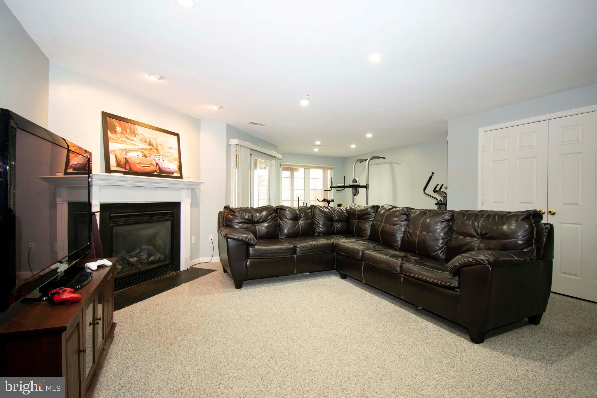 2556 Running Wolf Trail Odenton, MD 21113 - Photo 25 of 36 Basement fully finished with another gas fireplac!