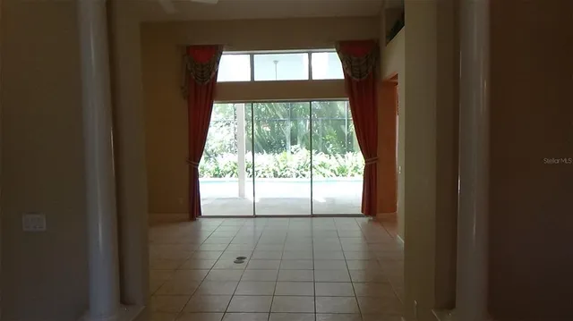 a view of a room with a windows and wooden floor