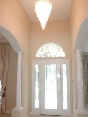 an empty room with a empty space and windows