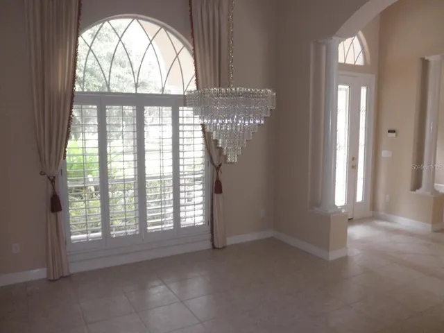 a bathroom with a shower and a window