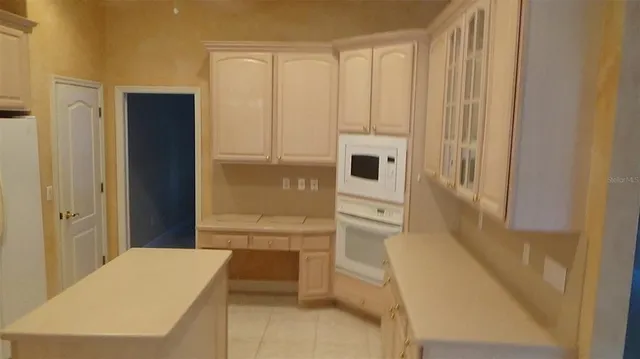 a bathroom with a shower and a sink