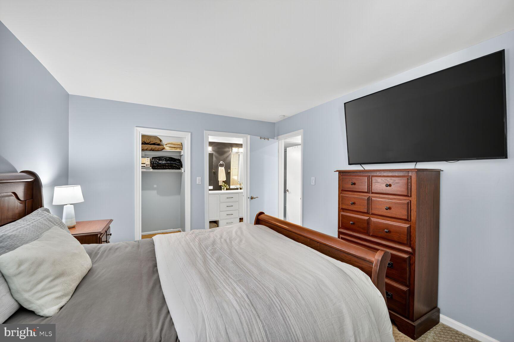 4519 28th Road South, Unit A Arlington, VA 22206 - Photo 13 of 33 a bedroom with a bed and a flat screen tv