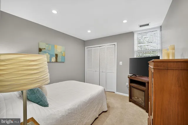 a bedroom with a bed and furniture