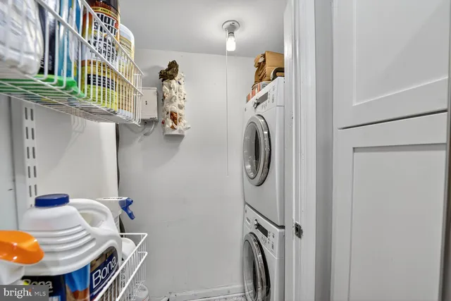 a bathroom with a sink mirror vanity and toilet