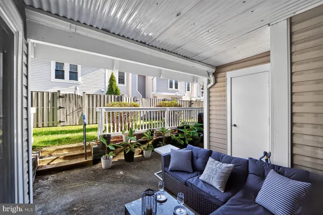 a balcony with furniture and garden view