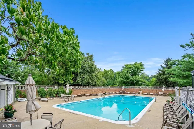a view of a swimming pool with a patio