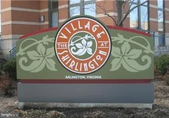 a sign that is on a brick wall