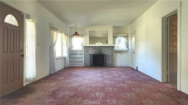 a kitchen with a refrigerator and a sink