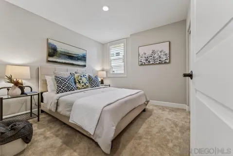 a bedroom with a bed and furniture
