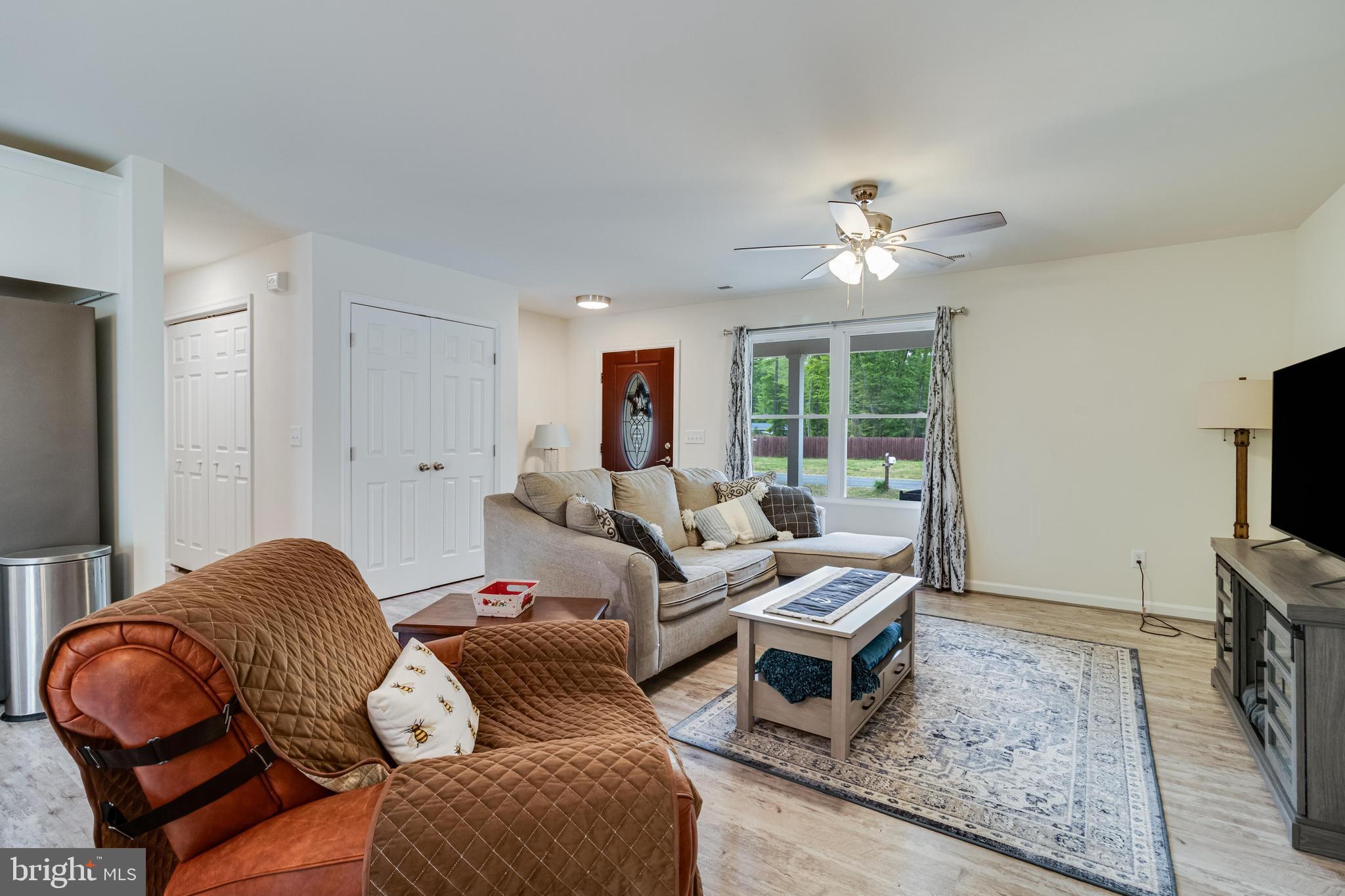 32 Placid Road Colonial Beach, VA 22443 - Photo 21 of 54 a living room with furniture and a flat screen tv