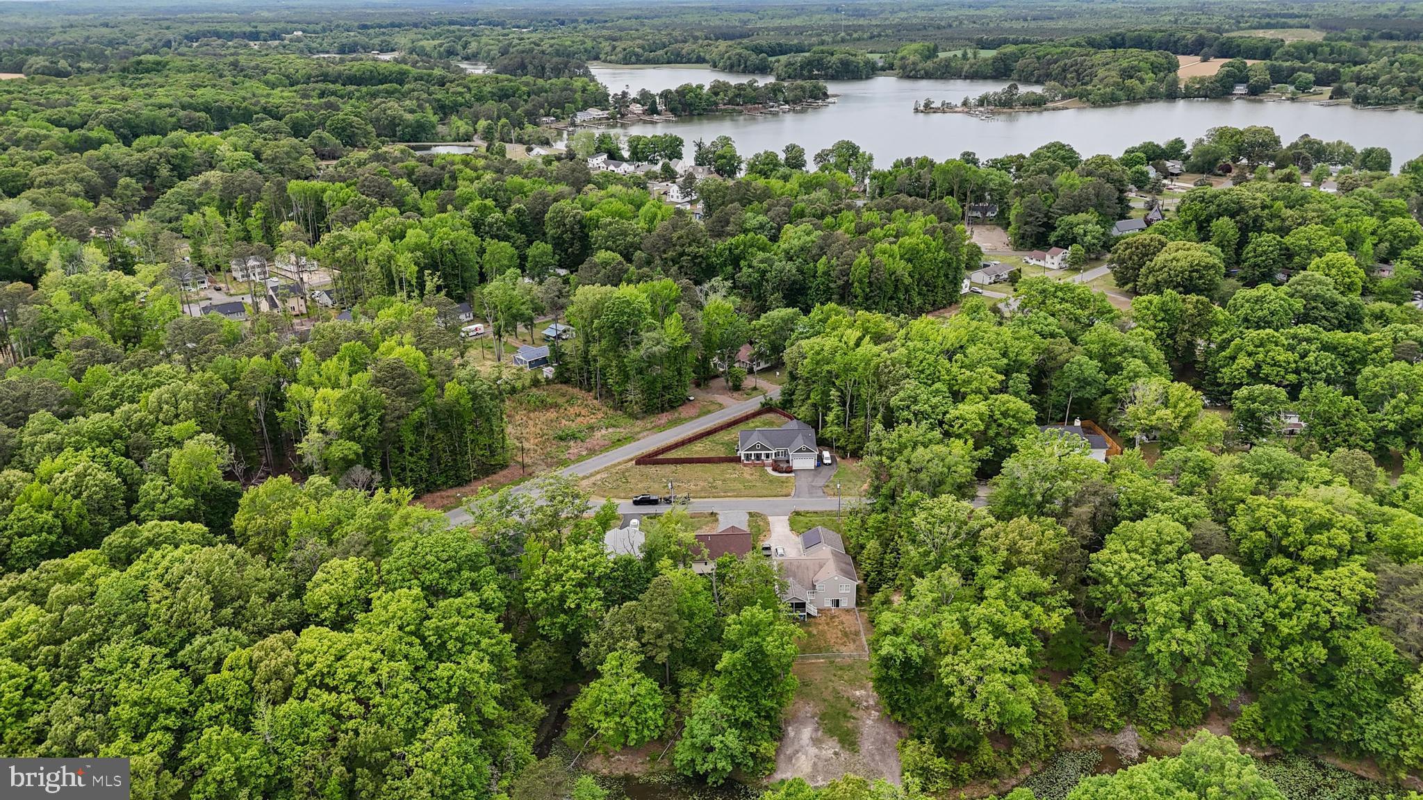 32 Placid Road Colonial Beach, VA 22443 - Photo 45 of 54 a view of a lake with a building in the background