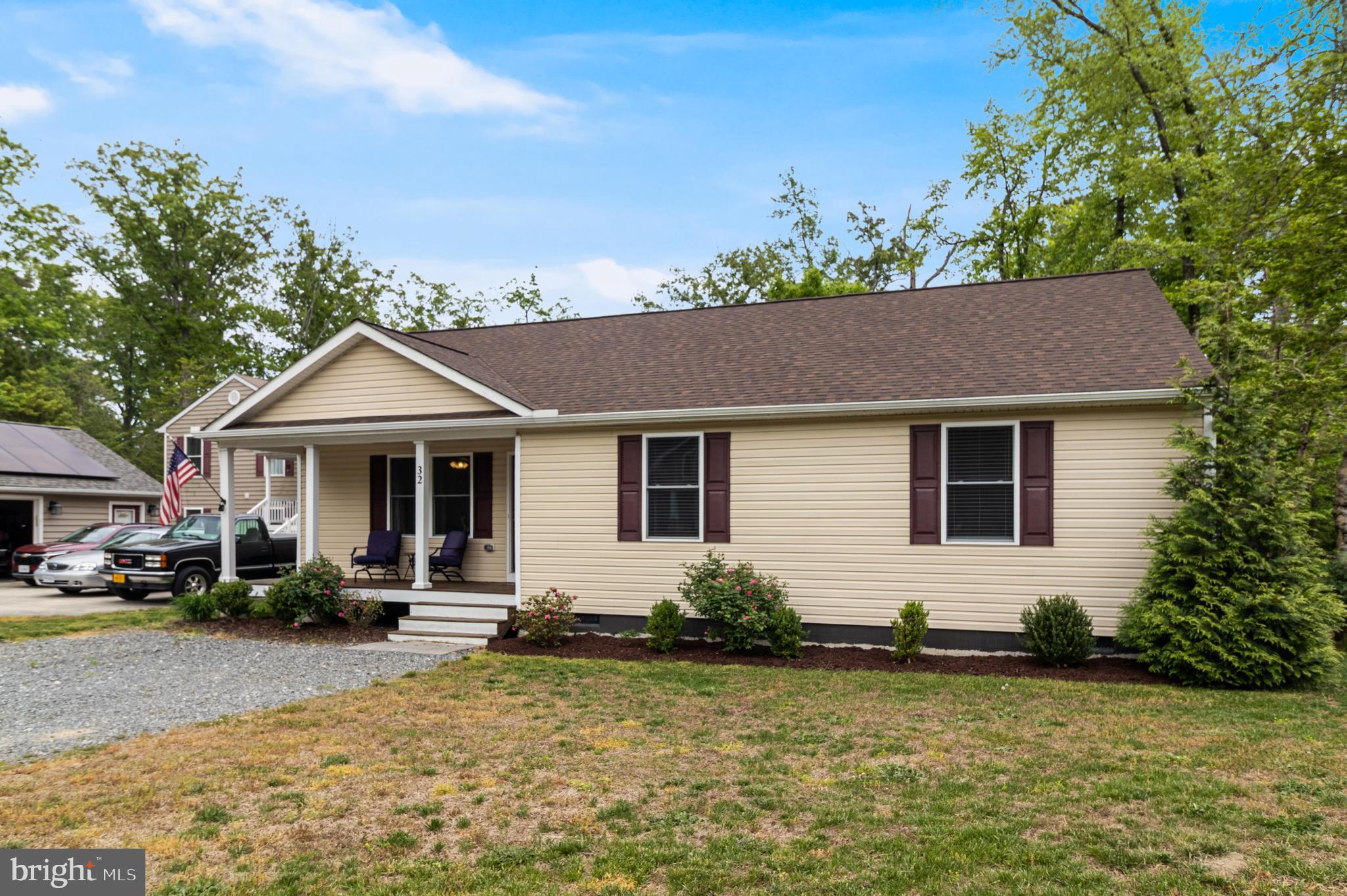 32 Placid Road Colonial Beach, VA 22443 - Photo 48 of 54 a front view of a house with a yard