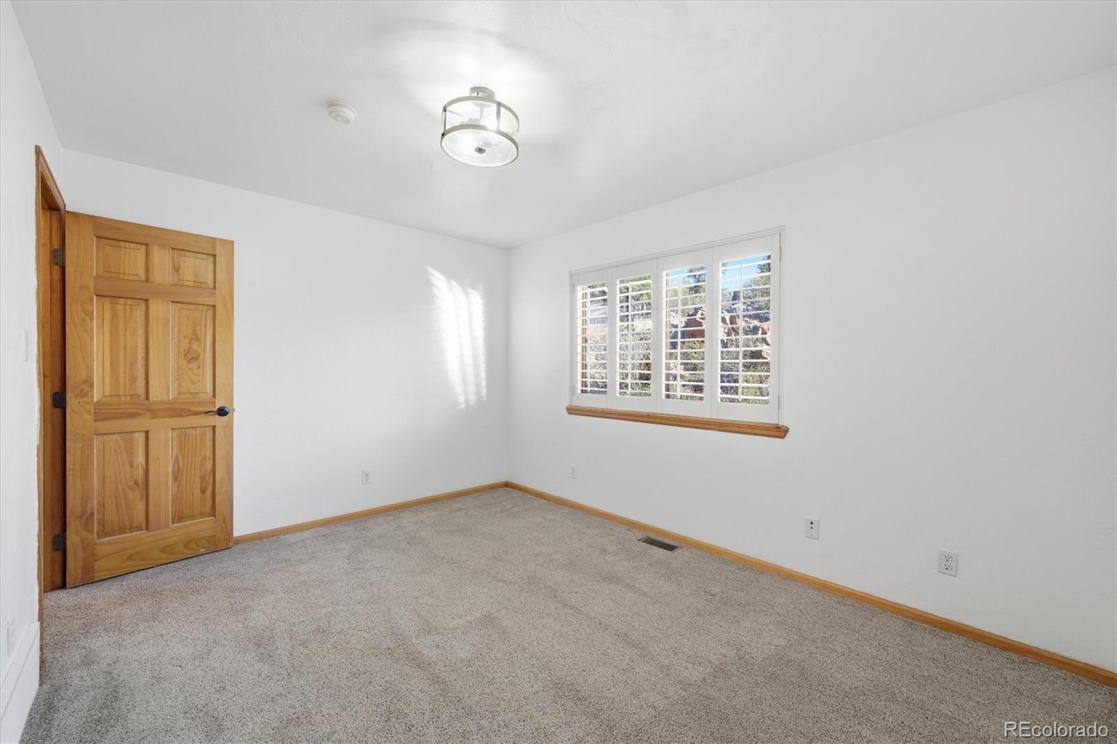 33799 Warren Road Pine, CO 80470 - Photo 32 of 50 an empty room with windows