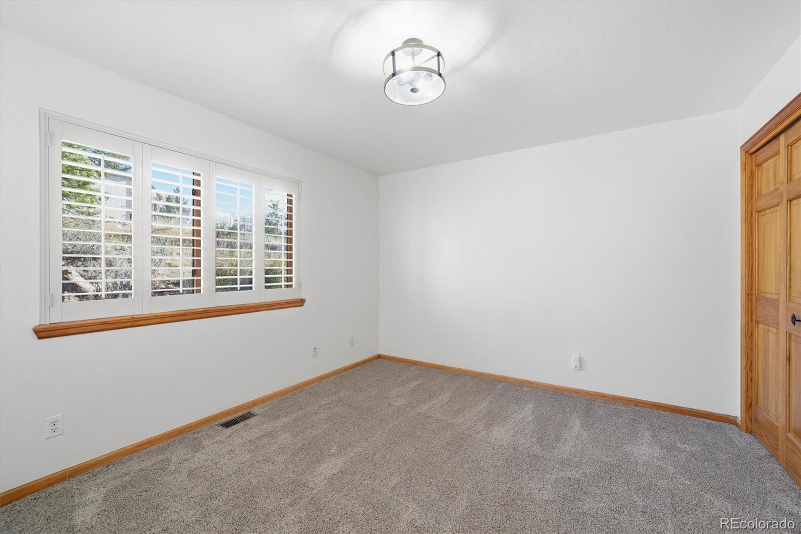 33799 Warren Road Pine, CO 80470 - Photo 37 of 50 an empty room with windows