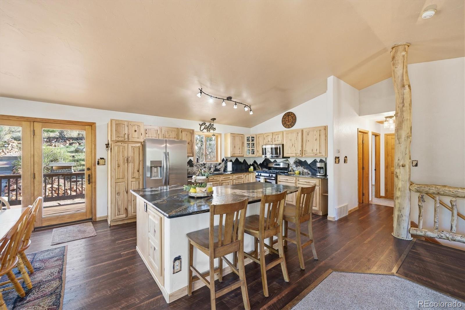 33799 Warren Road Pine, CO 80470 - Photo 40 of 50 a very nice looking dining room with a large window and wooden floor