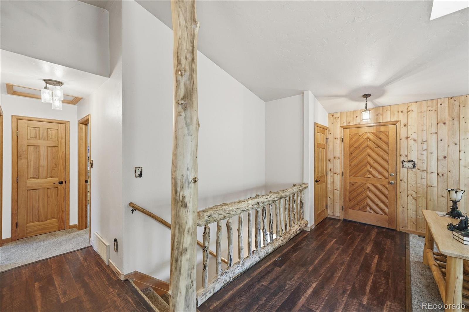 33799 Warren Road Pine, CO 80470 - Photo 46 of 50 a view of entryway with wooden floor