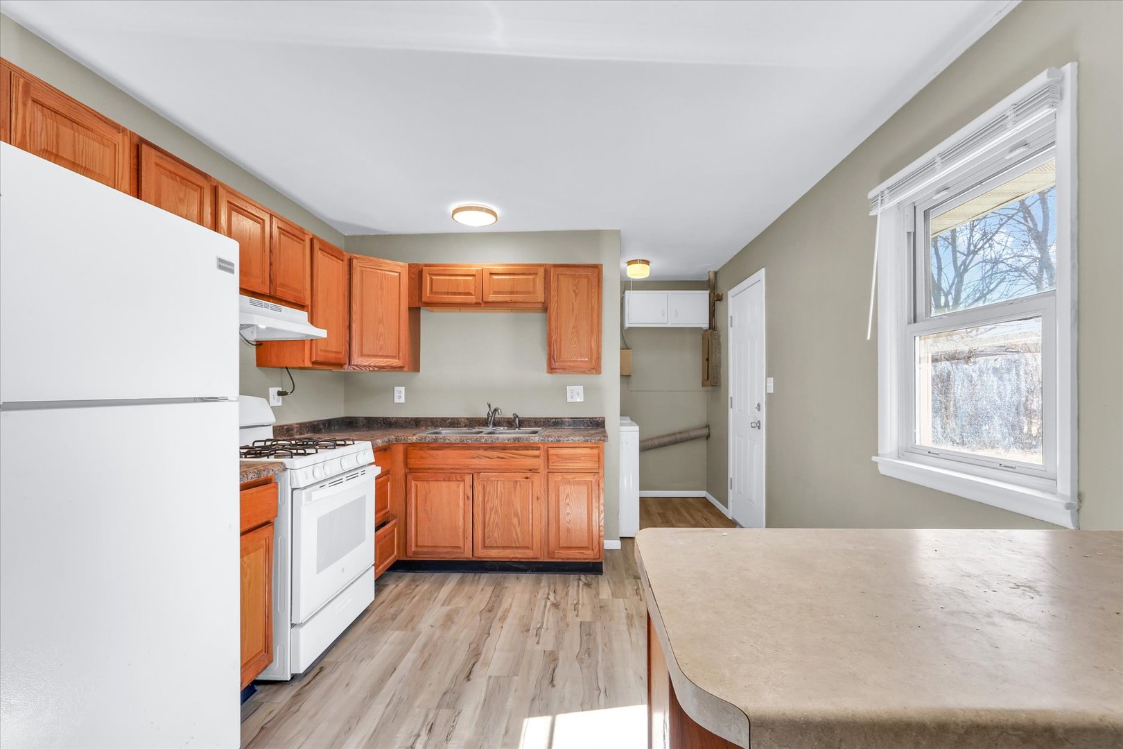 4 Hedge Court Champaign, IL 61821 - Photo 10 of 23 a kitchen with stainless steel appliances granite countertop a stove a sink and a refrigerator