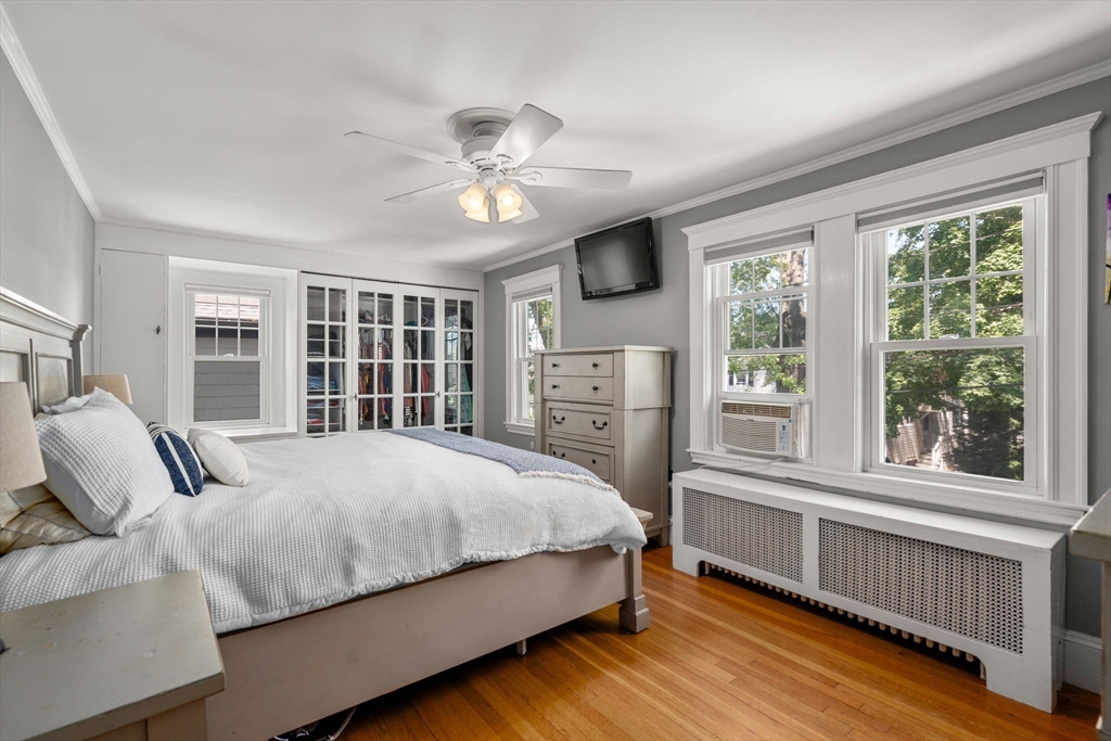27 Frothingham Street Milton, MA 02186 - Photo 15 of 32 a bedroom with a large bed and a large window