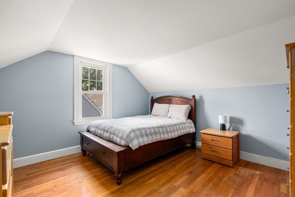 27 Frothingham Street Milton, MA 02186 - Photo 23 of 32 a bedroom with a bed and wooden floor