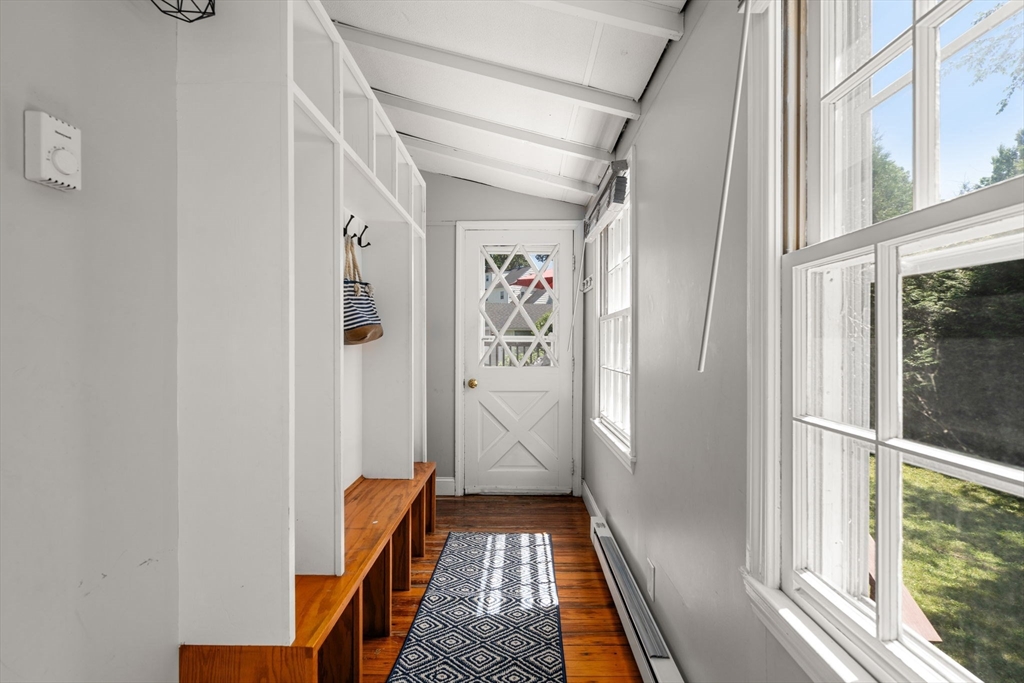 27 Frothingham Street Milton, MA 02186 - Photo 25 of 32 a view of a hallway with wooden floor and a window