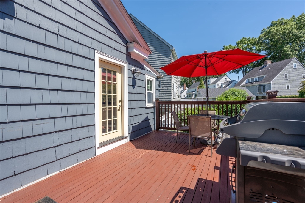 27 Frothingham Street Milton, MA 02186 - Photo 26 of 32 a view of balcony with a potted plant and wooden floor
