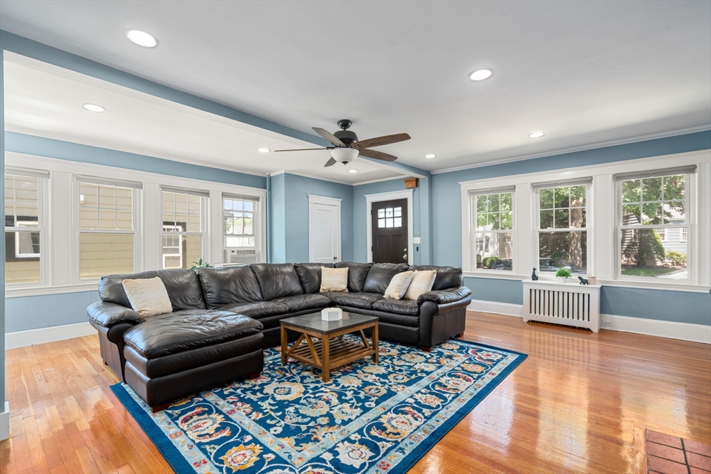 27 Frothingham Street Milton, MA 02186 - Photo 4 of 32 a living room with furniture and a rug